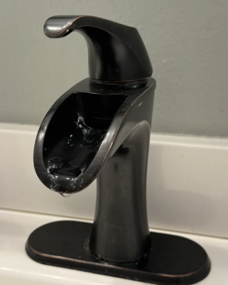 Bathroom faucet before cleaning